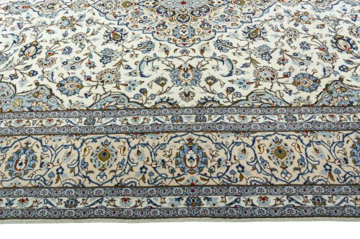 Corner detail of 2000s Kashan rug showing border pattern and Wool pile