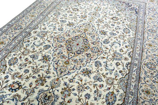 Backside of handmade 2000s Kashan rug showing knot structure and weave density