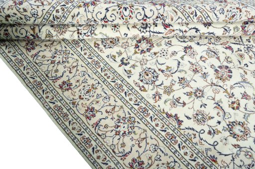 Close-up detail of 2000s Kashan rug from Iran / Persia showing Wool weave