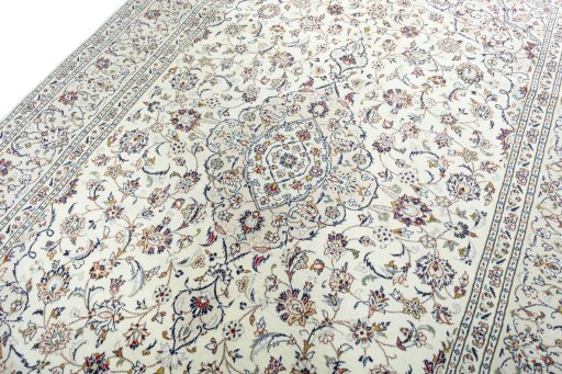 Backside of handmade 2000s Kashan rug showing knot structure and weave density