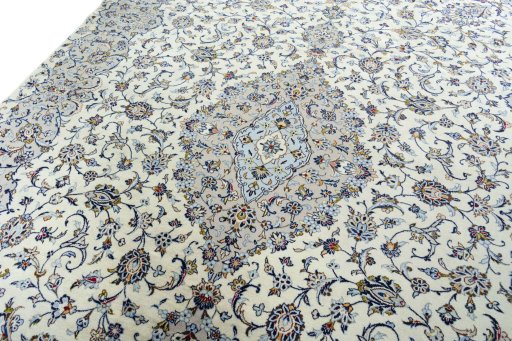 Backside of handmade New Kashan rug showing knot structure and weave density