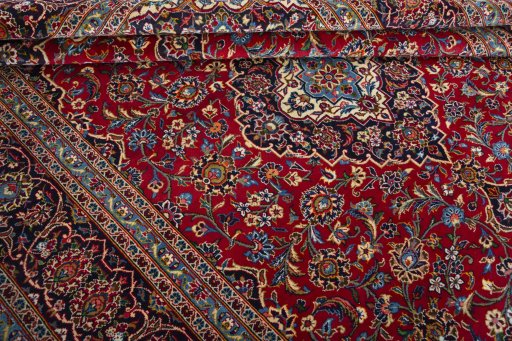 Close-up detail of 2000s Kashan rug from Iran / Persia showing Wool weave