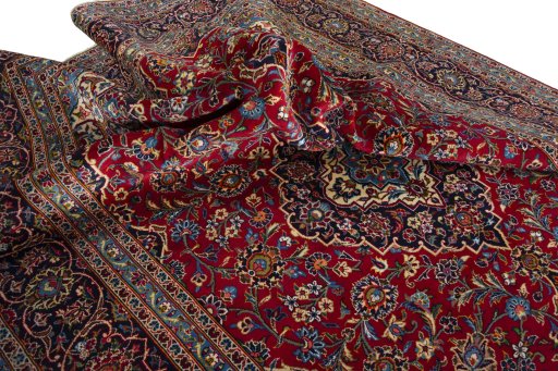 Surface texture of 2000s Kashan rug with natural Wool and intricate pattern