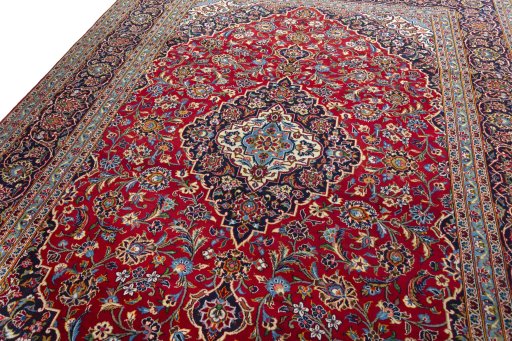 Backside of handmade 2000s Kashan rug showing knot structure and weave density