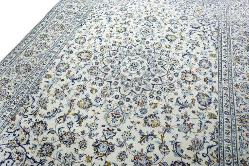 Backside of handmade 2000s Kashan rug showing knot structure and weave density