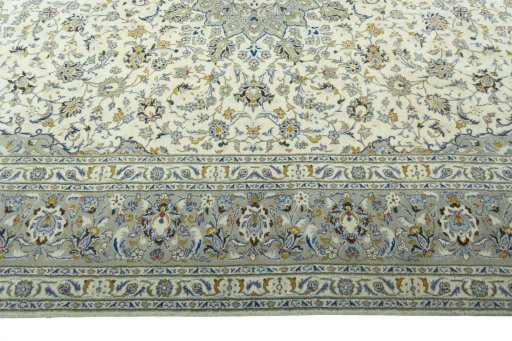 Corner detail of 2000s Kashan rug showing border pattern and Wool pile