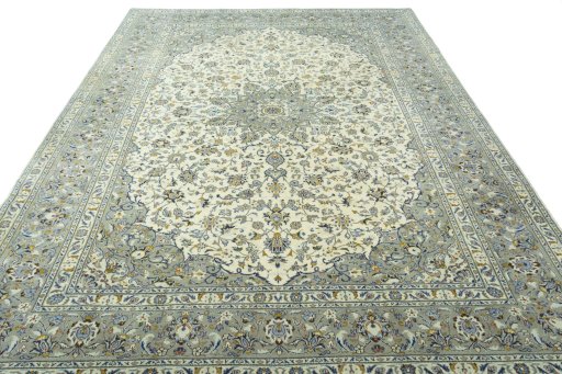 Surface texture of 2000s Kashan rug with natural Wool and intricate pattern
