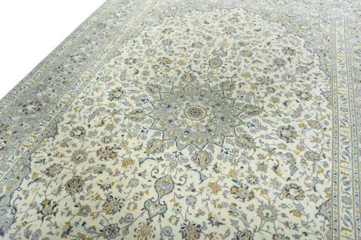 Backside of handmade 2000s Kashan rug showing knot structure and weave density