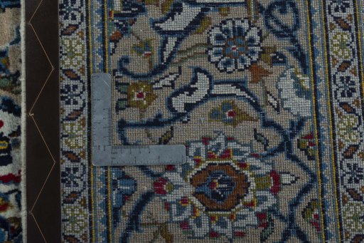 Backside of handmade 2000s Kashan rug showing knot structure and weave density