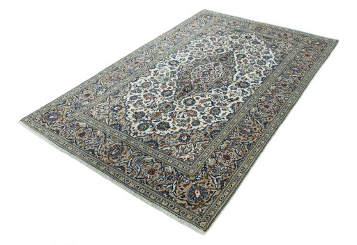 Corner detail of 2000s Kashan rug showing border pattern and Wool pile