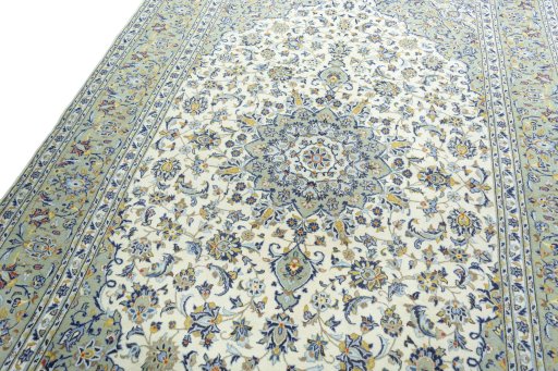 Backside of handmade 2000s Kashan rug showing knot structure and weave density
