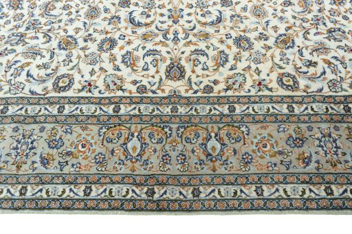 Corner detail of 2000s Kashan rug showing border pattern and Wool pile