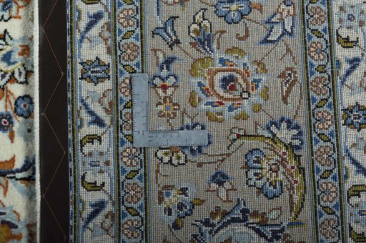 Backside of handmade 2000s Kashan rug showing knot structure and weave density