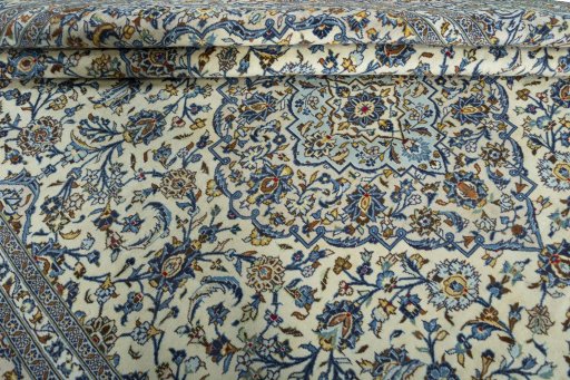 Close-up detail of 2000s Kashan rug from Iran / Persia showing Wool weave