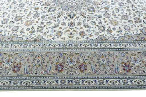 Corner detail of New Kashan rug showing border pattern and Wool pile