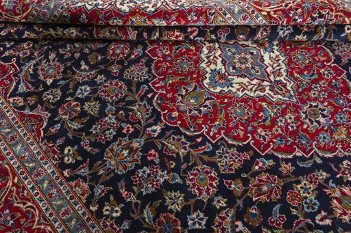 Close-up detail of 2000s Kashan rug from Iran / Persia showing Wool weave