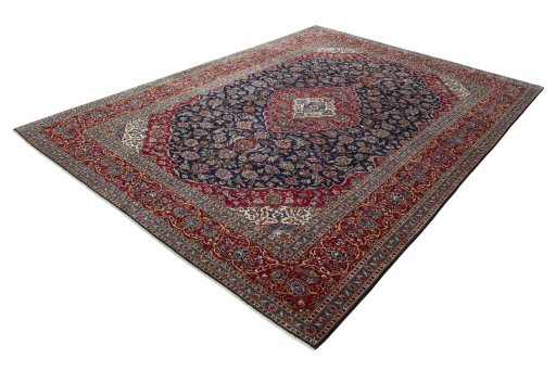 Corner detail of 2000s Kashan rug showing border pattern and Wool pile