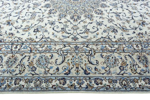 Corner detail of 2000s Kashan rug showing border pattern and Wool pile
