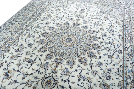 Backside of handmade 2000s Kashan rug showing knot structure and weave density