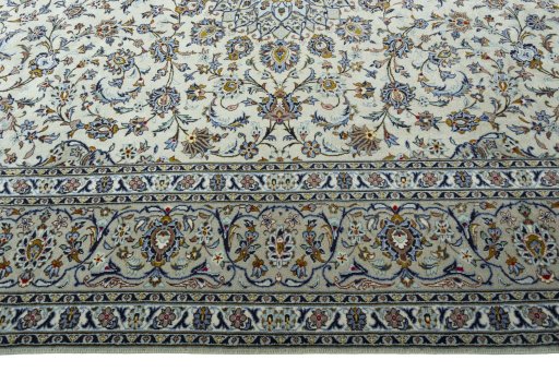 Corner detail of 2000s Kashan rug showing border pattern and Wool pile