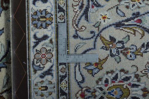 Backside of handmade 2000s Kashan rug showing knot structure and weave density