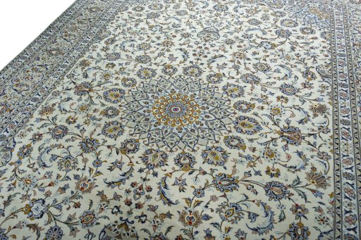 Backside of handmade 2000s Kashan rug showing knot structure and weave density
