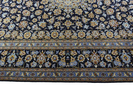 Corner detail of 1970s Kashan rug showing border pattern and Wool pile