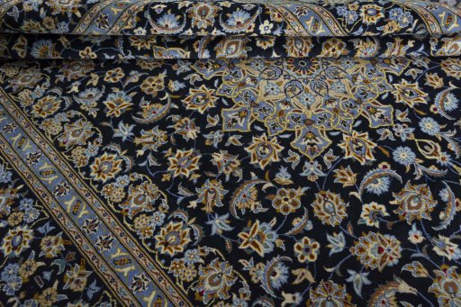 Close-up detail of 1970s Kashan rug from Iran / Persia showing Wool weave