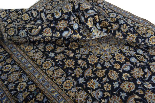 Surface texture of 1970s Kashan rug with natural Wool and intricate pattern
