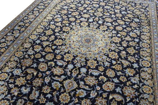 Backside of handmade 1970s Kashan rug showing knot structure and weave density