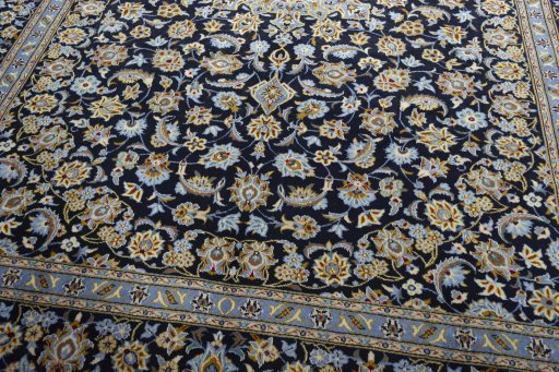 Close-up detail of 1970s Kashan rug from Iran / Persia showing Wool weave