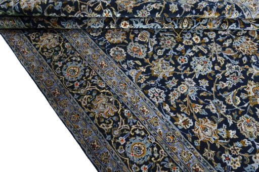 Close-up detail of 2000s Kashan rug from Iran / Persia showing Wool weave