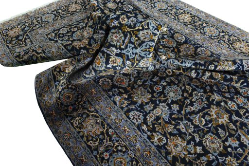 Surface texture of 2000s Kashan rug with natural Wool and intricate pattern