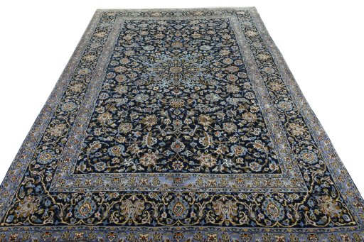 Surface texture of 2000s Kashan rug with natural Wool and intricate pattern