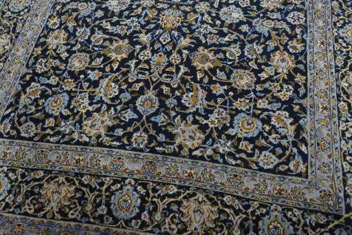 Close-up detail of 2000s Kashan rug from Iran / Persia showing Wool weave