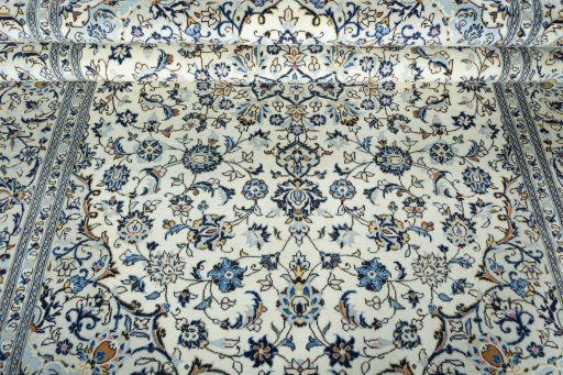 Close-up detail of 2000s Kashan rug from Iran / Persia showing Wool weave