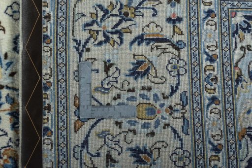 Backside of handmade 2000s Kashan rug showing knot structure and weave density