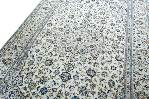 Backside of handmade 2000s Kashan rug showing knot structure and weave density