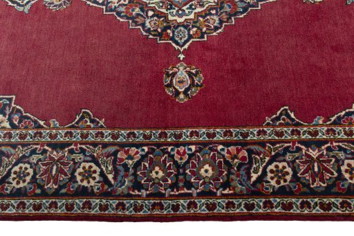 Corner detail of 1930s Kashan rug showing border pattern and Wool pile