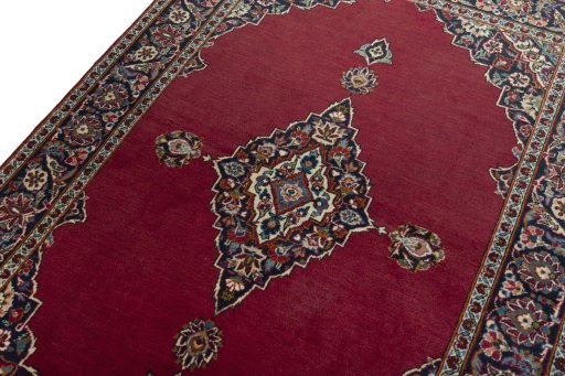 Backside of handmade 1930s Kashan rug showing knot structure and weave density