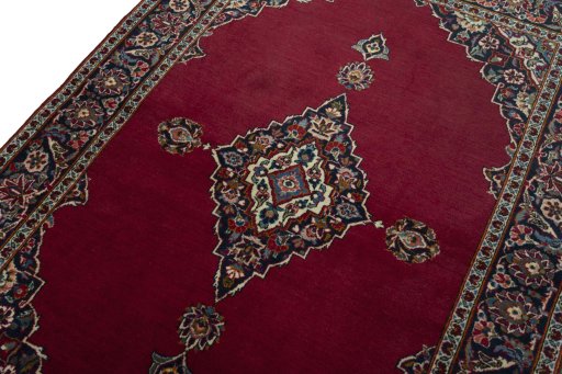 Backside of handmade 1930s Kashan rug showing knot structure and weave density