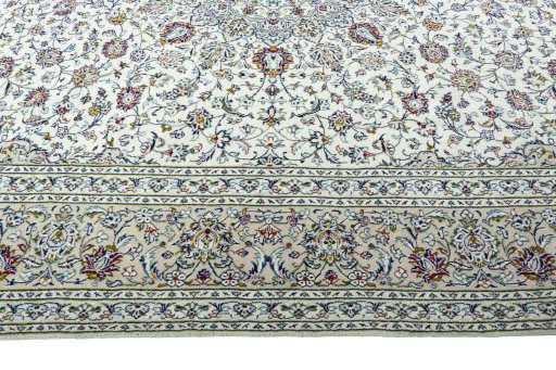 Corner detail of 2000s Kashan rug showing border pattern and Wool pile