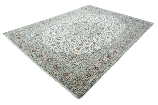 Corner detail of 2000s Kashan rug showing border pattern and Wool pile