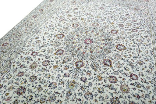 Backside of handmade 2000s Kashan rug showing knot structure and weave density