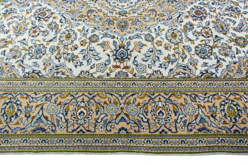 Corner detail of 2000s Kashan rug showing border pattern and Wool pile
