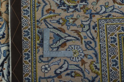 Backside of handmade 2000s Kashan rug showing knot structure and weave density