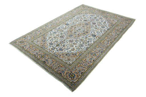 Corner detail of 2000s Kashan rug showing border pattern and Wool pile