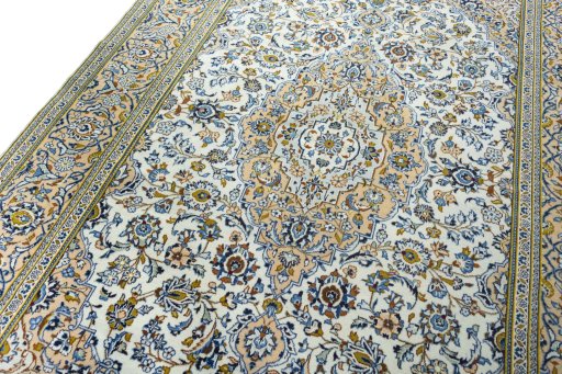 Backside of handmade 2000s Kashan rug showing knot structure and weave density