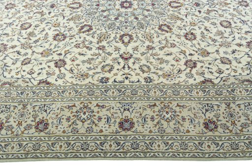 Corner detail of 2000s Kashan rug showing border pattern and Wool pile