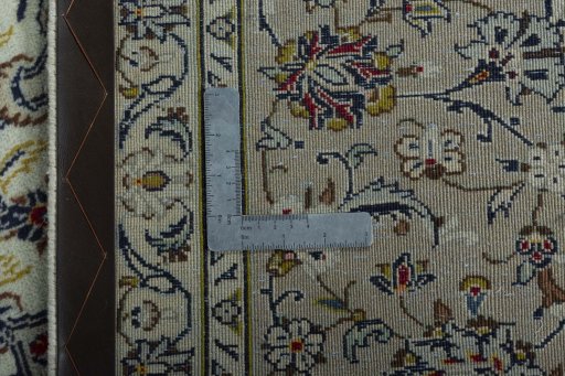 Backside of handmade 2000s Kashan rug showing knot structure and weave density